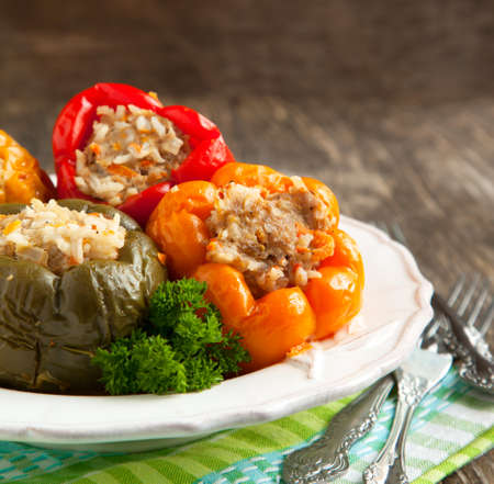Colorful peppers stuffed with meat, rice and vegetablesの写真素材