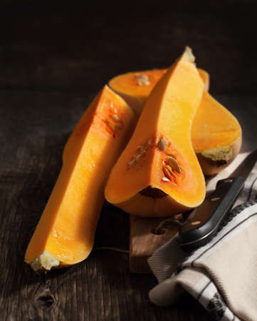Butternut pumpkin on wooden tableの写真素材