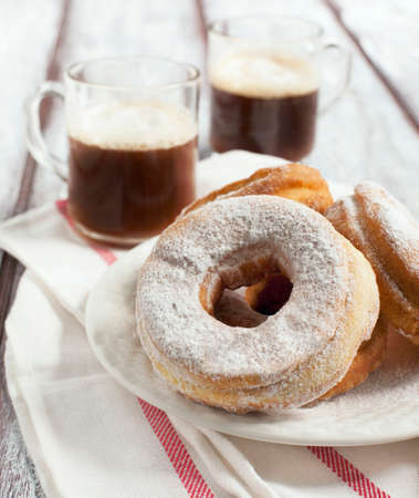 Cup of coffee and donutsの写真素材
