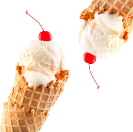 Ice cream cone with maraschino cherry isolated on white backgroundの写真素材