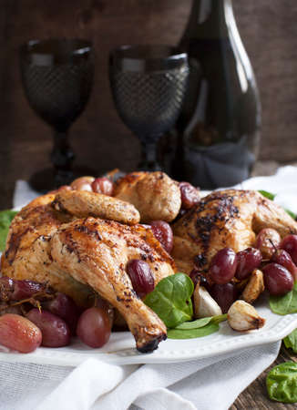 Roast chicken with grapesの写真素材