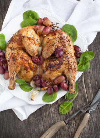 Roast chicken with grapesの写真素材