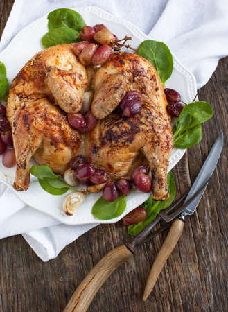 Roast chicken with grapesの写真素材