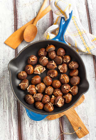 Roasted chestnuts in the pan の写真素材