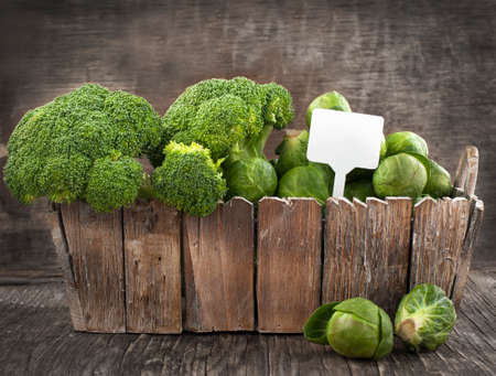 Assortment cabbages on wooden backgroundの写真素材