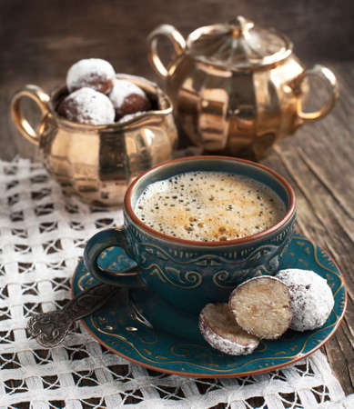 Cup of coffee and white chocolate cake pops の写真素材