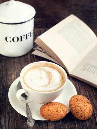Cup of coffee and oatmeal cookies  Toned imageの写真素材