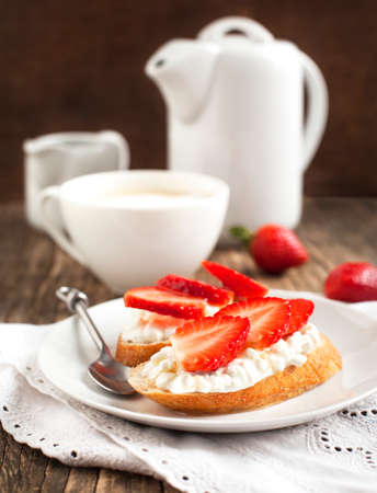Fresh bread with Cottage cheese, strawberry and honeyの写真素材