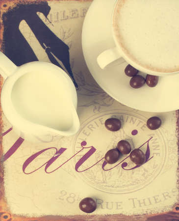 Cup of coffee and chocolate coffee beans  Toned imageの写真素材