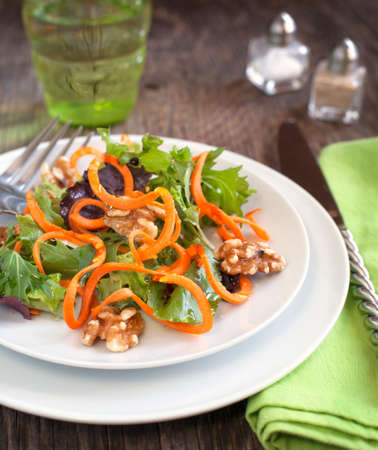 Spring green salad with carrotの写真素材