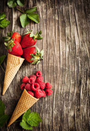 Raspberry and strawberry in sugar conesの写真素材
