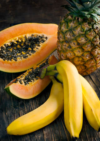 Tropical fruits  Bananas, papaya and pineappleの写真素材