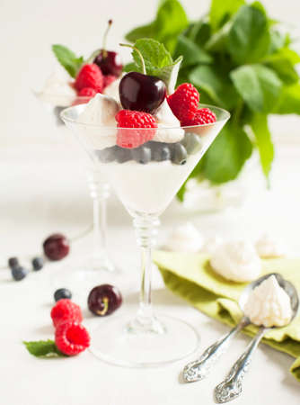 White chocolate mousse with berries and meringueの写真素材