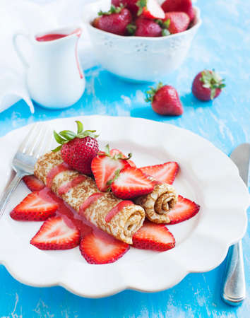 Crepes with fresh strawberry and strawberry sauceの写真素材