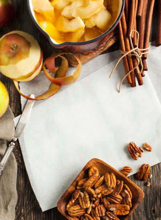 Autumn food background with apples, spices and nuts. Ingredients for baking apple pie.の写真素材