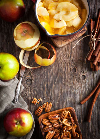 Autumn food background with apples, spices and nuts. Ingredients for baking apple pie.の写真素材