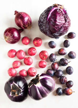%u0421ollection of fresh purple toned vegetables on white wooden の写真素材