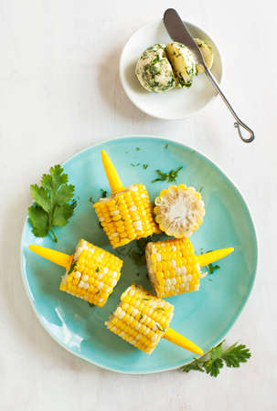 Cooked corn with herb butterの写真素材