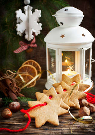 Christmas composition with gingerbread and candleの写真素材