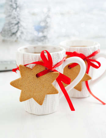 Two cups of hot tea and gingerbreadの写真素材