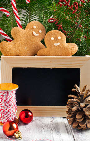 Christmas decorations with gingerbread cookies and chalk blackboard.の写真素材