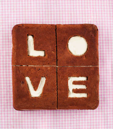 Love Cake. Chocolate banana cake with creamcheese frosting and word Love.の写真素材