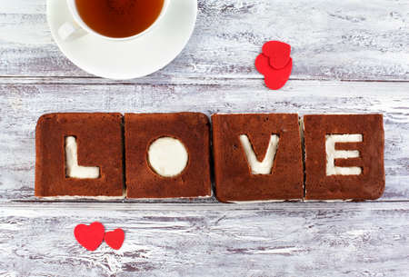 Love Cake. Chocolate banana cake with creamcheese frosting and word Love.の写真素材