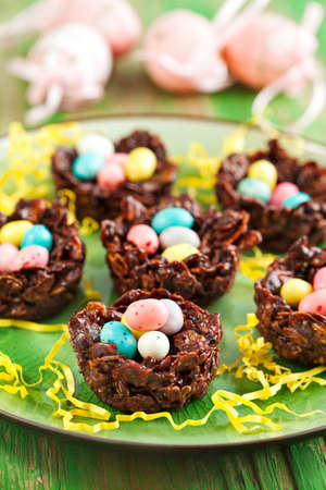 Chocolate nest with colorful candyの写真素材
