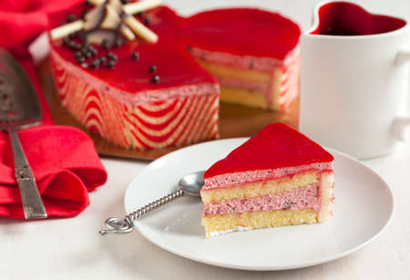 Strawberry mousse cake in the shape of a heartの写真素材