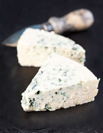 Blue cheese on black backgroundの写真素材