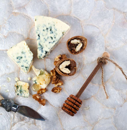 Blue cheese with honey and walnuts.の写真素材