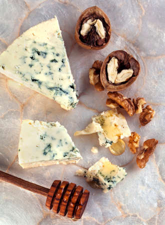 Blue cheese with honey and walnuts.の写真素材