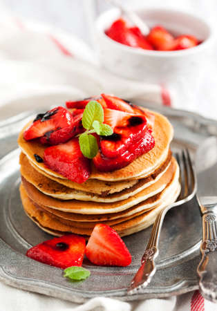 Stack of pancakes with fresh strawberry and balsamic glaseの写真素材