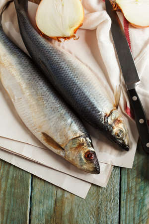 Salted herring on a wooden table