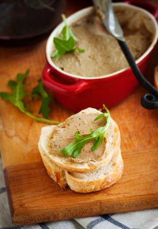 Chicken liver pate on bread and wineの写真素材