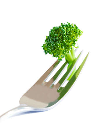 Fresh broccoli on fork izolated on white backgroundの写真素材