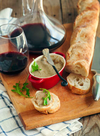 Chicken liver pate on bread and wineの写真素材