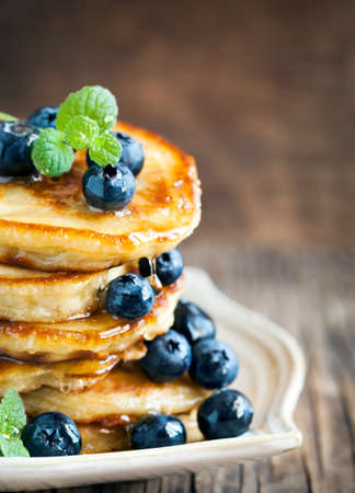 Stack of pancakes with fresh blueberry and honeyの写真素材