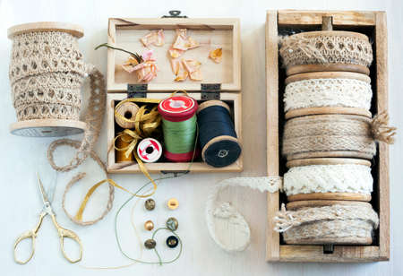 Tools for needlework thread for sewing scissors buttons and vintage laces . Top viewの写真素材