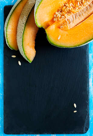 Cantaloupe melon slices. Top viewの写真素材