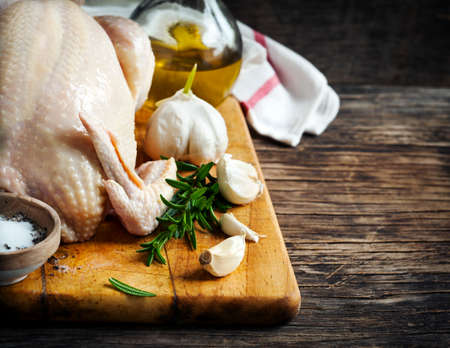 Raw chicken. Preparation for baking garlic chickenの写真素材