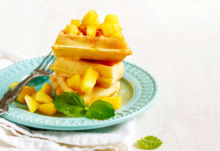 Belgian waffles with caramelized apple and honeyの写真素材
