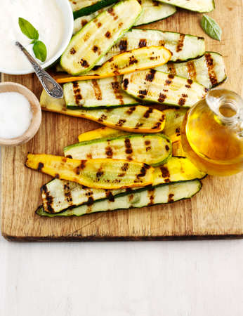 Grilled zucchini with sauceの写真素材