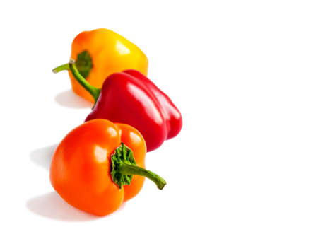 Fresh mini bell peppers isolated on white background.の写真素材