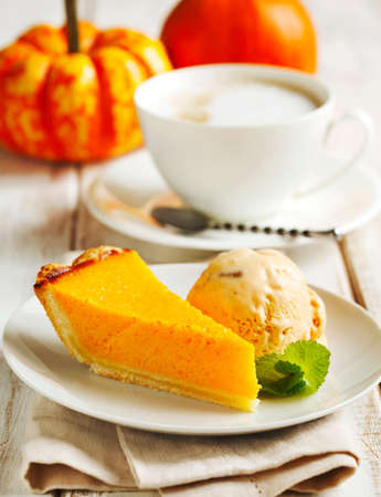 Pumpkin pie served with pumpkin ice cream.の写真素材
