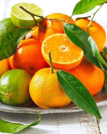 Fresh citrus fruits with leavesの写真素材