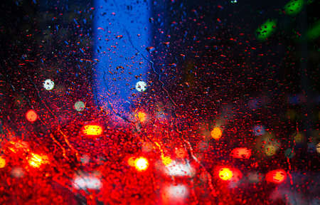 Night city through windshield. Street Bokeh Lights Out Of Focus.