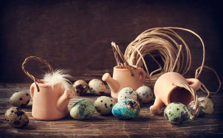 Still life with quail eggs on wooden boardの写真素材