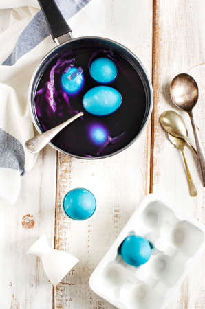 Homemade decoration eggs natural way. Naturally coloring Easter eggs with red cabbageの写真素材