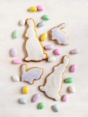 Easter cookies and almond candy on wooden backgroundの写真素材